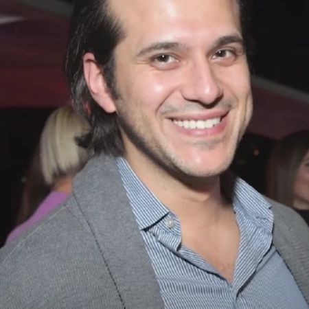 Jonathan Davino is in the party smiling for the camera.